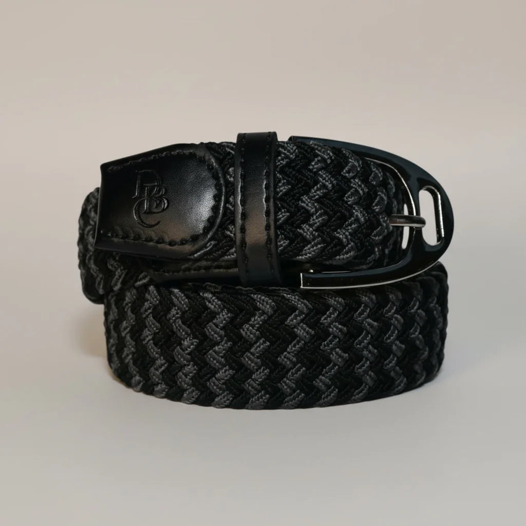 Front view of the black Dubois Cheval Stretch Stirrup Belt on a gray background