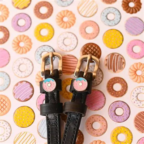 Front view of the Donuts Mane Jane Spur Straps on a pastry background