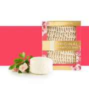 View of the Floral Rose Germanium Hairy Pony Eco-Friendly Shampoo Bar with roses on a pink and white color block background