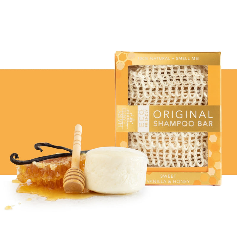 View of the vanilla and honey Hairy Pony Eco-Friendly Shampoo Bar with a honeycomb an orange and white color block background