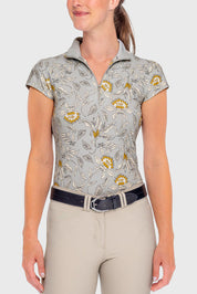 Front view of a female model wearing the vintage dove Kastel Cap Sleeve 1/4 Zip Sun Shirt on a plain background