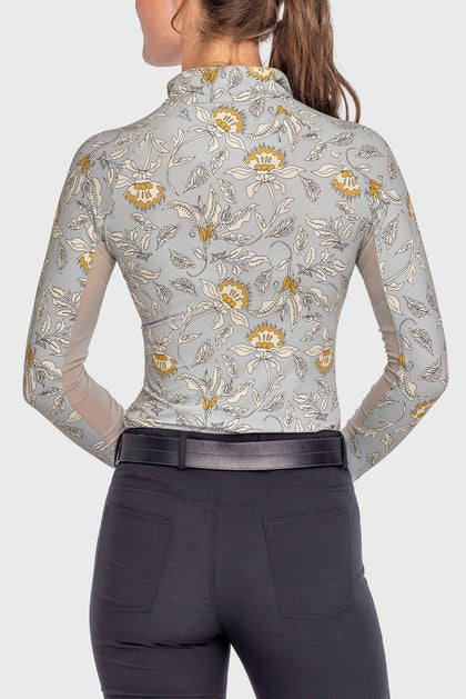 Back view of a female model wearing the Dove Vintage Jacobean Kastel 1/4 Zip Long Sleeve Sun Shirt on a plain background