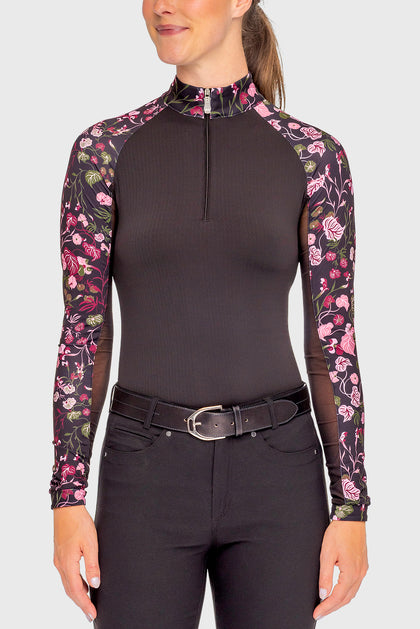 Front view of a female model wearing the Black Begonia Kastel Long Sleeve Raglan 1/4 Zip Sun Shirt on a plain background