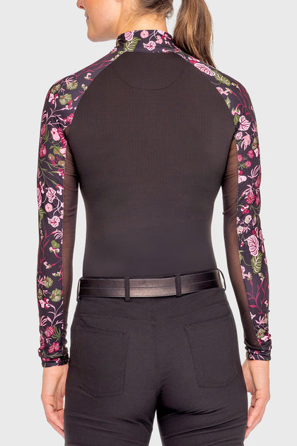Front view of a female model wearing the Black Begonia Kastel Long Sleeve Raglan 1/4 Zip Sun Shirt on a plain background