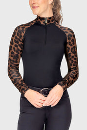 Front view of a female model wearing the Espresso Leopard Kastel Long Sleeve Raglan 1/4 Zip Sun Shirt on a plain background