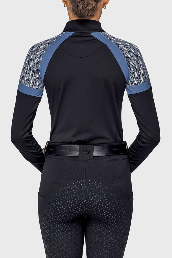 Back view of a female model wearing the Black/Pacific Blue Deco Fans Kastel 1/4 Zip Long Sleeve Sun Shirt on a plain background