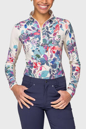 Front view of a female model wearing the Amethyst Watercolor Floral Kastel 1/4 Zip Long Sleeve Sun Shirt on a plain background