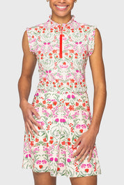 Front view of a model wearing the Red Scandinavian Berries Kastel 1/4 Zip Ruffle Tank and matching skirt on a plain background