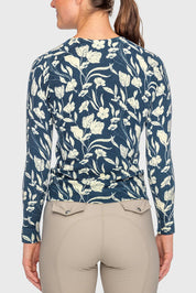 Back view of a female model wearing the Sailor Blue French Tulip Kastel Crewneck Sweater on a plain background