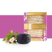 View of the whitening Floral Rose Germanium Hairy Pony Eco-Friendly Shampoo Bar with roses on a purple and white color block background