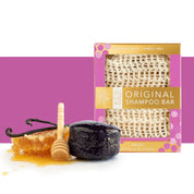 View of the whitening vanilla and honey Hairy Pony Eco-Friendly Shampoo Bar with a honeycomb a purple and white color block background