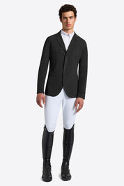 Rider’s Gene men’s black jersey competition jacket, front view, worn with white breeches and tall black riding boots