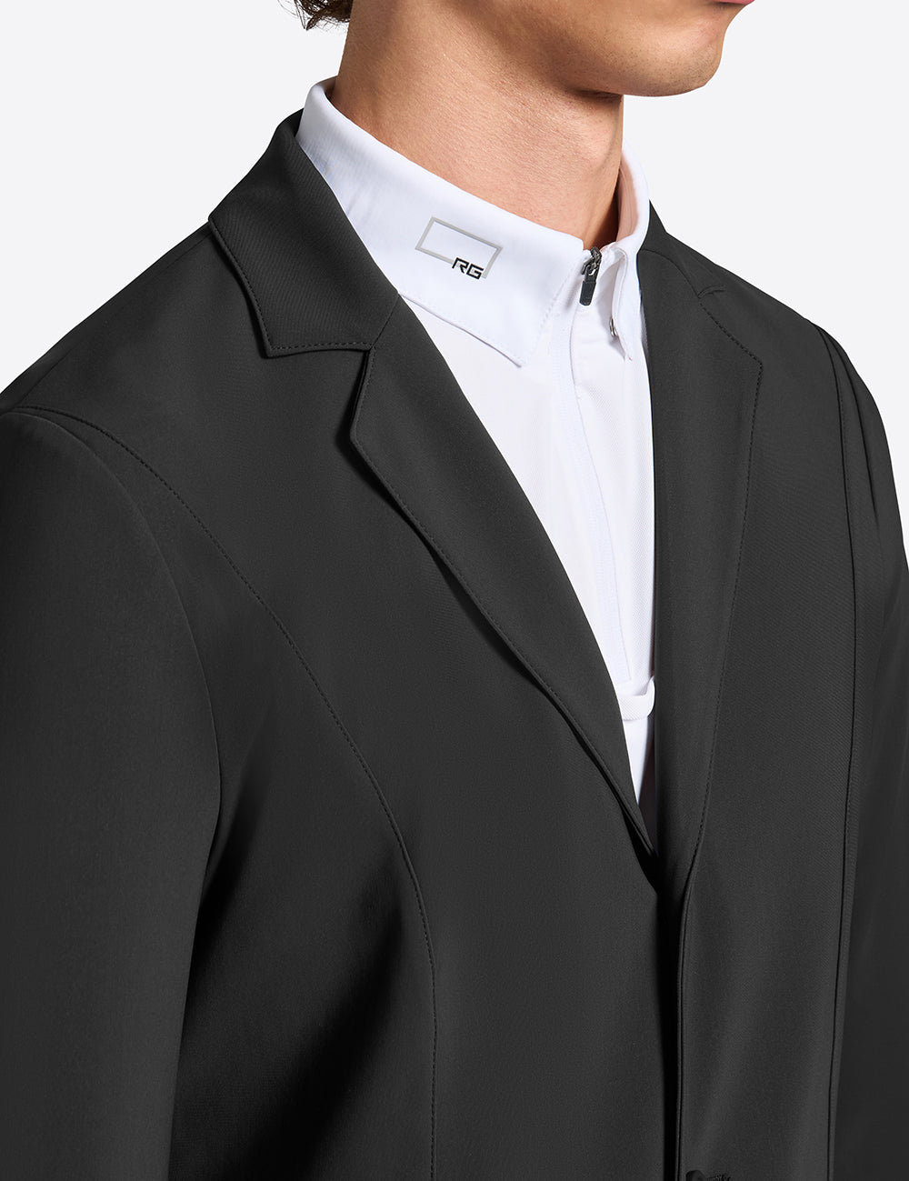 Close-up of Rider’s Gene men’s black competition jacket showing lapel and collar detail over white show shirt