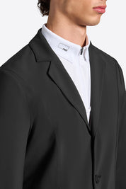 Close-up of Rider’s Gene men’s black competition jacket showing lapel and collar detail over white show shirt