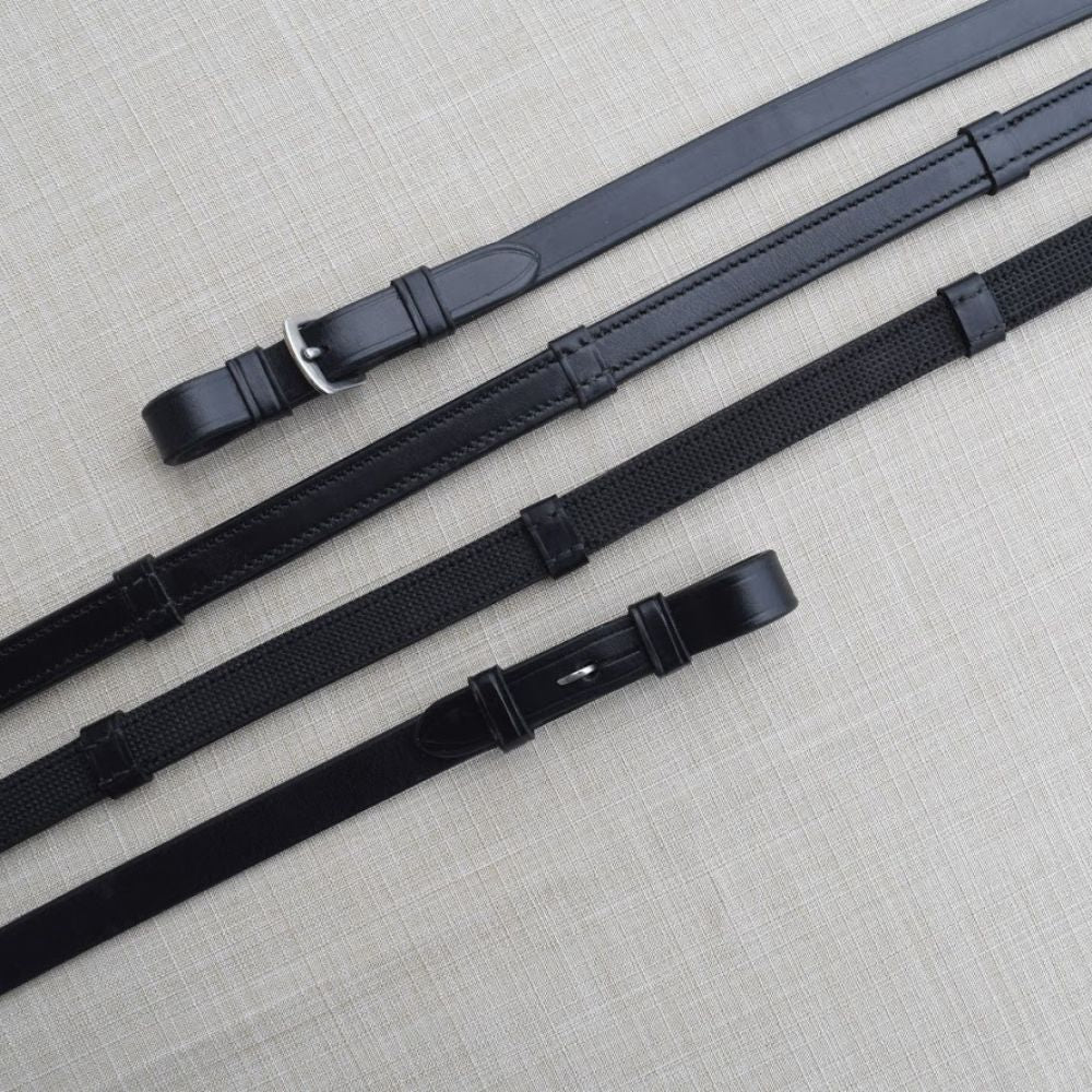 Side-by-side front and back views of a pair of black buckle and black pin Red Barn Easy Grip Reins with Stops on a textured background