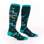 Side views of a pair of Just Here for the Drama Sock It To Me Stretch-It Knee High Socks on a white background