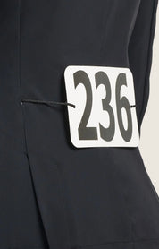 Close-up back view of a 236 competition number tabard over the black RJ Classics Kids Shore Show Coat