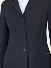 Close-up of the RJ Classics Sloane Show Coat in black showing the notched lapel, three-button front closure, and slanted zip pockets with a small RJ Classics tag.