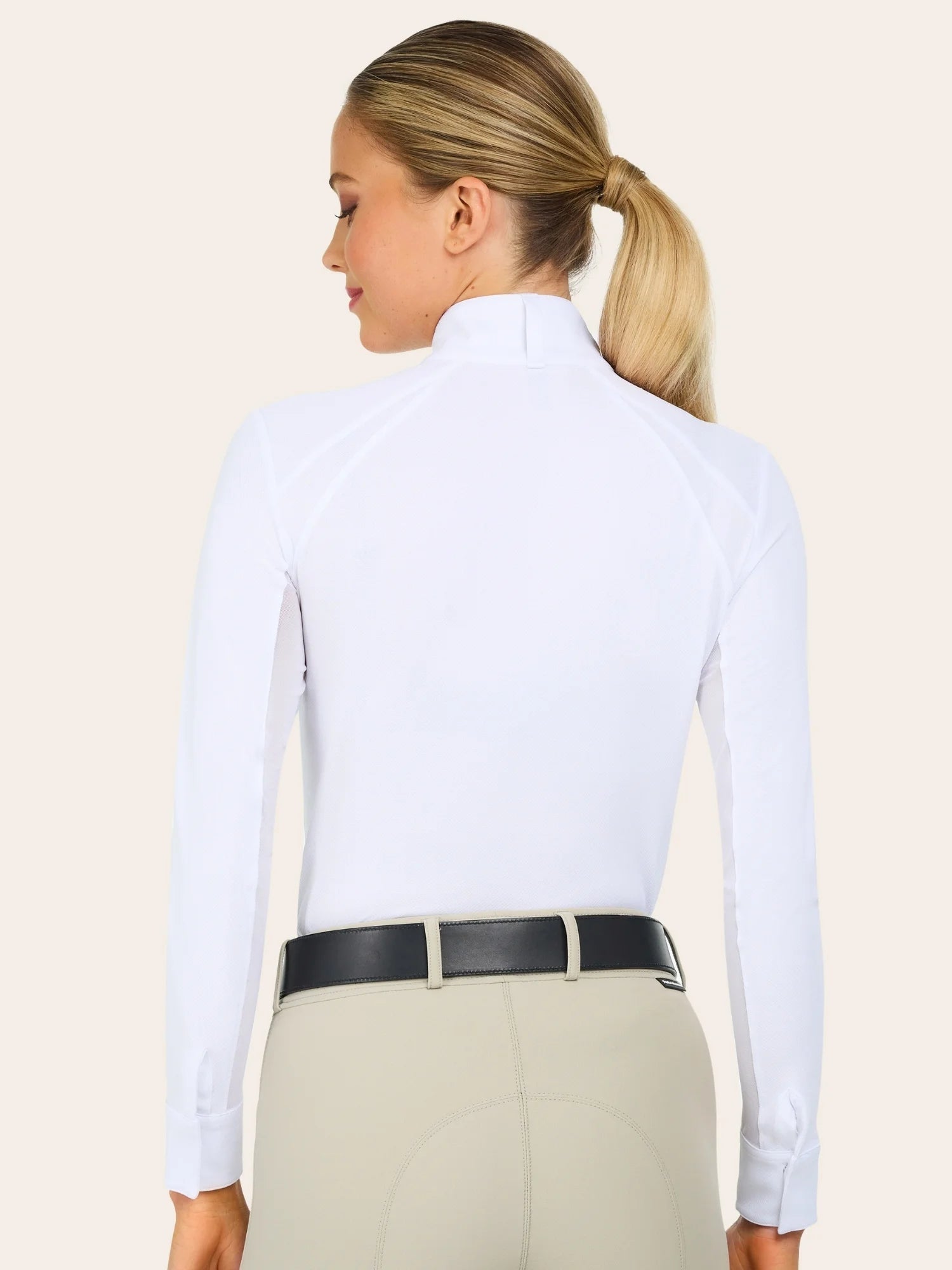 Back view of a female model wearing the white RJ Classics Sofia Long Sleeve Show Shirt on a plain background