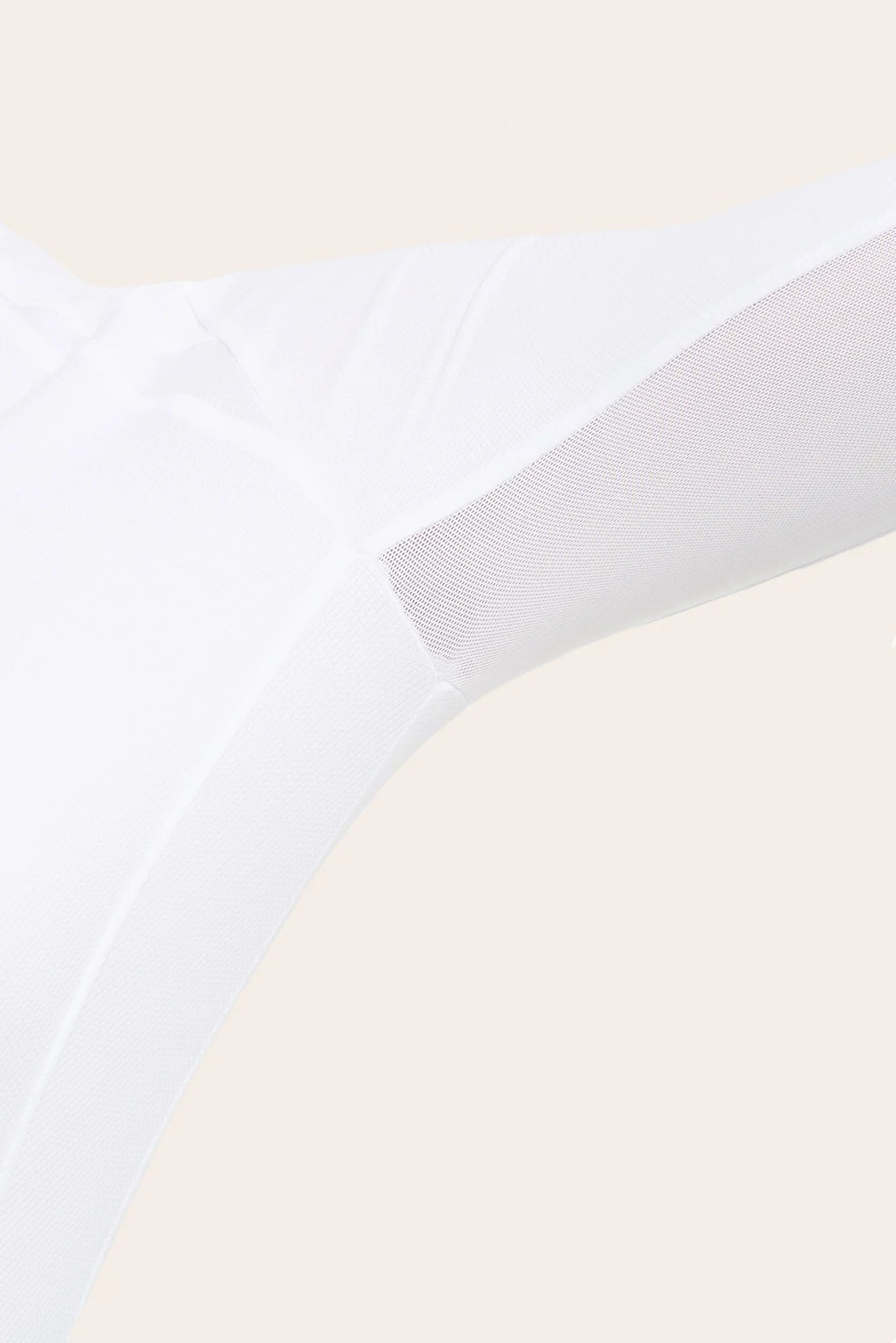 Close-up view of a female model showing the mesh fabric on the white RJ Classics Sofia Long Sleeve Show Shirt on a plain background