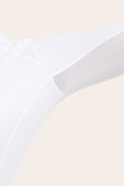Close-up view of a female model showing the mesh fabric on the white RJ Classics Sofia Long Sleeve Show Shirt on a plain background