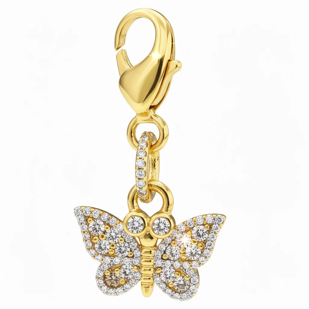 Front view of the gold butterfly Dubois Cheval Braid Charm on a white background