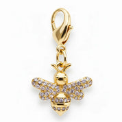 Front view of the gold bee Dubois Cheval Braid Charm on a white background