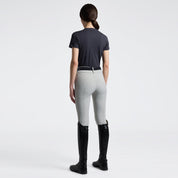 Cavalleria Toscana charcoal short sleeve T-shirt, back view, worn with light gray breeches and black tall boots
