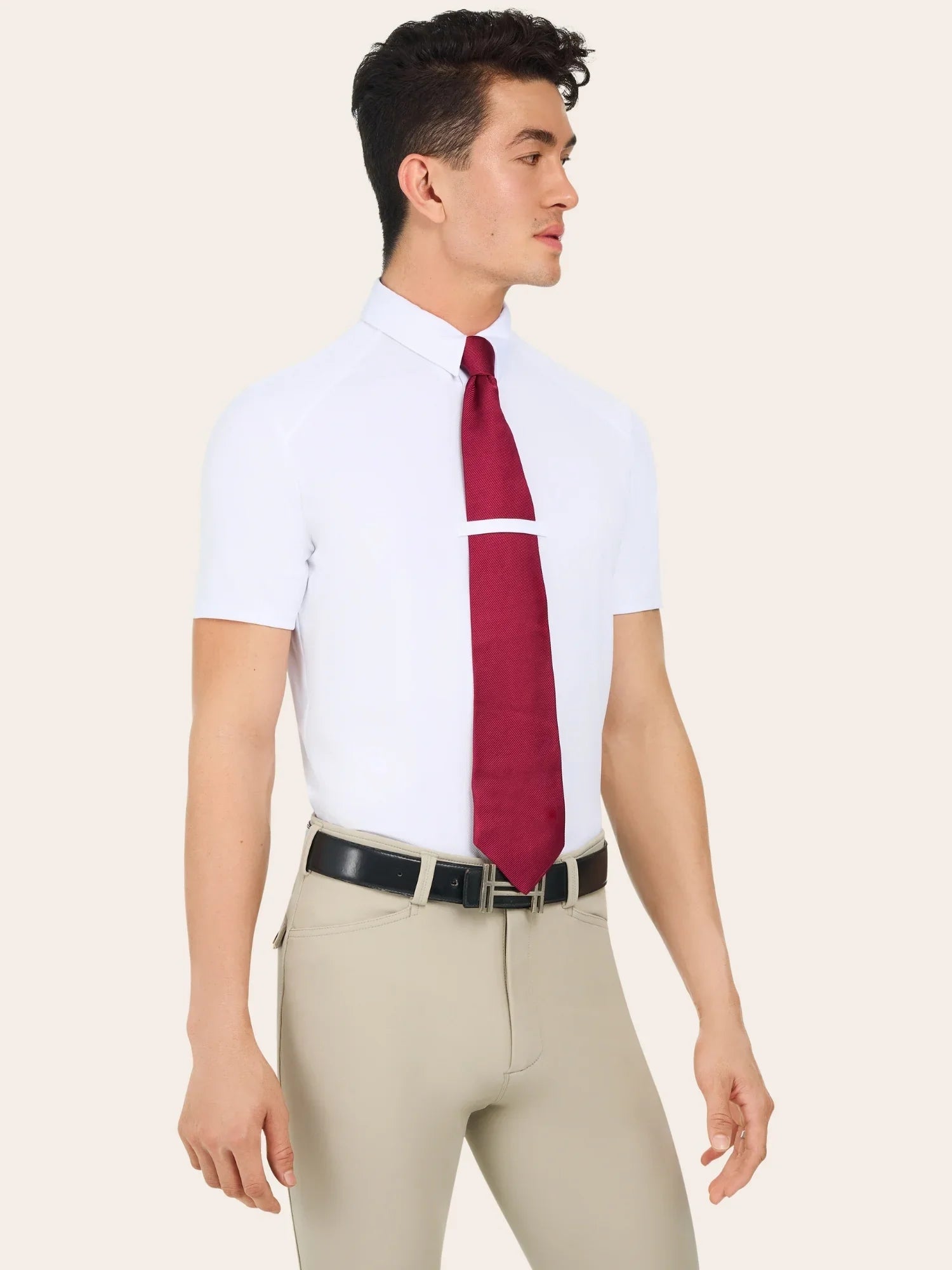 Front view of a male model wearing the white RJ Classics Tyler Show Shirt with red tie on a plain background