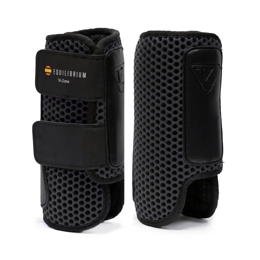 Front and back views of a pair of black Equilibrium Tri-Zone Impact Cross Country Hind Boot on a white background