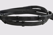 A pair of black Correct Connect Thumb Grip Reins on a white background