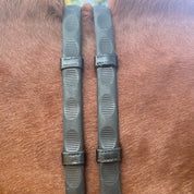A pair of black Correct Connect Thumb Grip Reins on a chestnut horse's neck