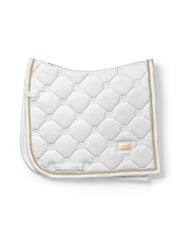 Side view of the gold Equestrian Stockholm White Perfection Dressage Pad on a white background
