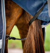 Close-up view of the hind leg straps on the navy Horseware Rambo 1680D Turnout 100g