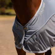 Angled front closeup view of a horse wearing Dusk Blue Equinavia Sommer Stable Sheet with NordicAir Tech