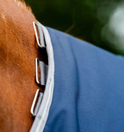 Close-up view of the hood loops on the navy Horseware Amigo 1200D Plus Turnout 250g