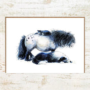 View of the H-Appy Pony Cat Sheepdog Pony Nut Greeting Card on a white washed wood background