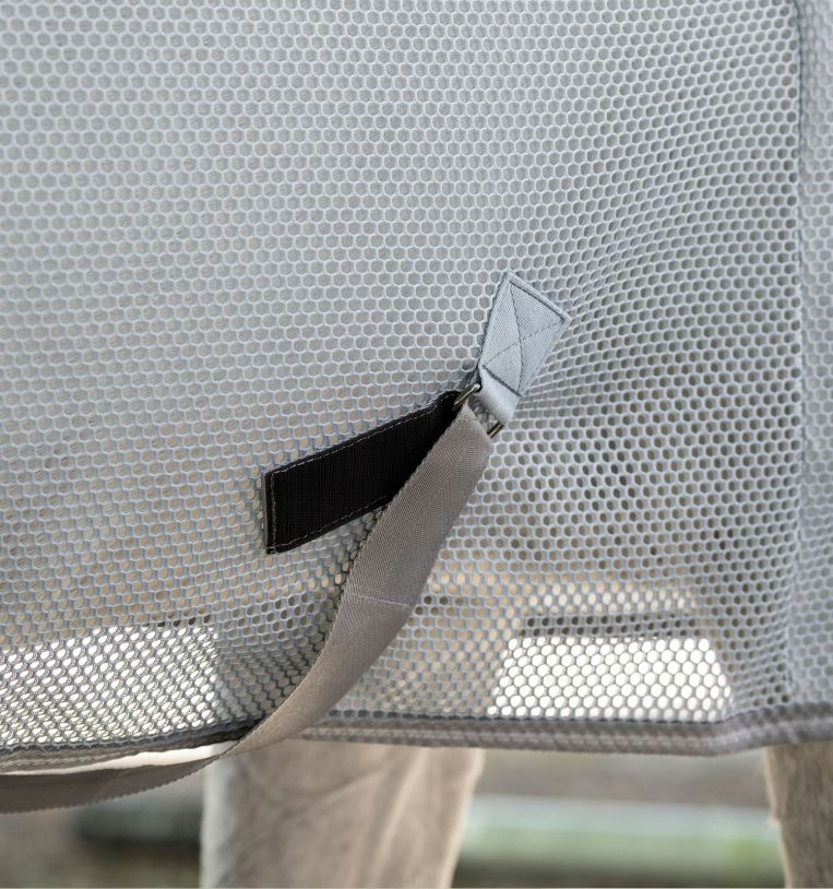 Close-up of Horseware Amigo Airnet Cooler mesh fabric with strap attachment detail