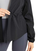 Close-up view of the waist gathering on the navy Horze Fiora Lightweight Waterproof Jacket on a white background