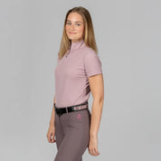 Angled side view of a model wearing Mellow Rose Equinavia Juni Short Sleeve Quarter Zip Shirt on a plain background