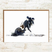 View of the There Be Dragons Pony Nut Greeting Card on a white washed wood background