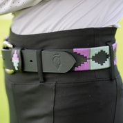 Close up view of the purple and gray, black-leather Equinavia Siri Polo Belt on black breeches