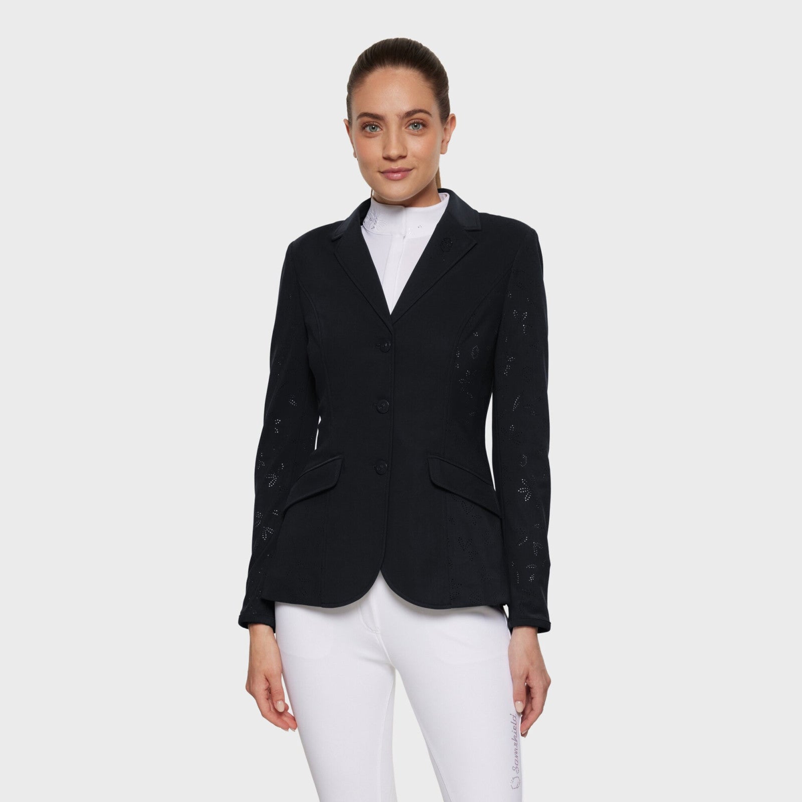 Front view of a female model wearing the black Samshield Alix Air Show Coat on a plain background