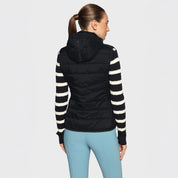 Back view of a female model wearing the black Samshield Alta Badia Vest on a plain background
