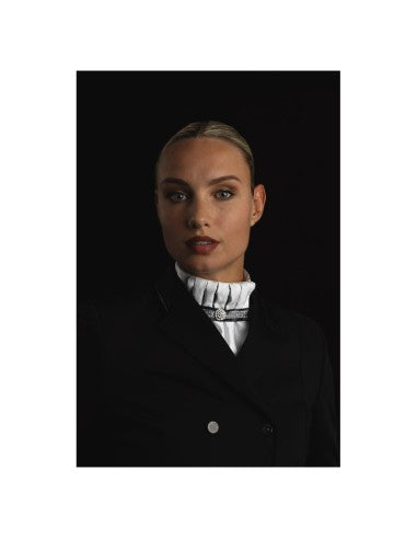Front view of a female model wearing the ANKY Pleated Crown Stock Tie under a black show coat