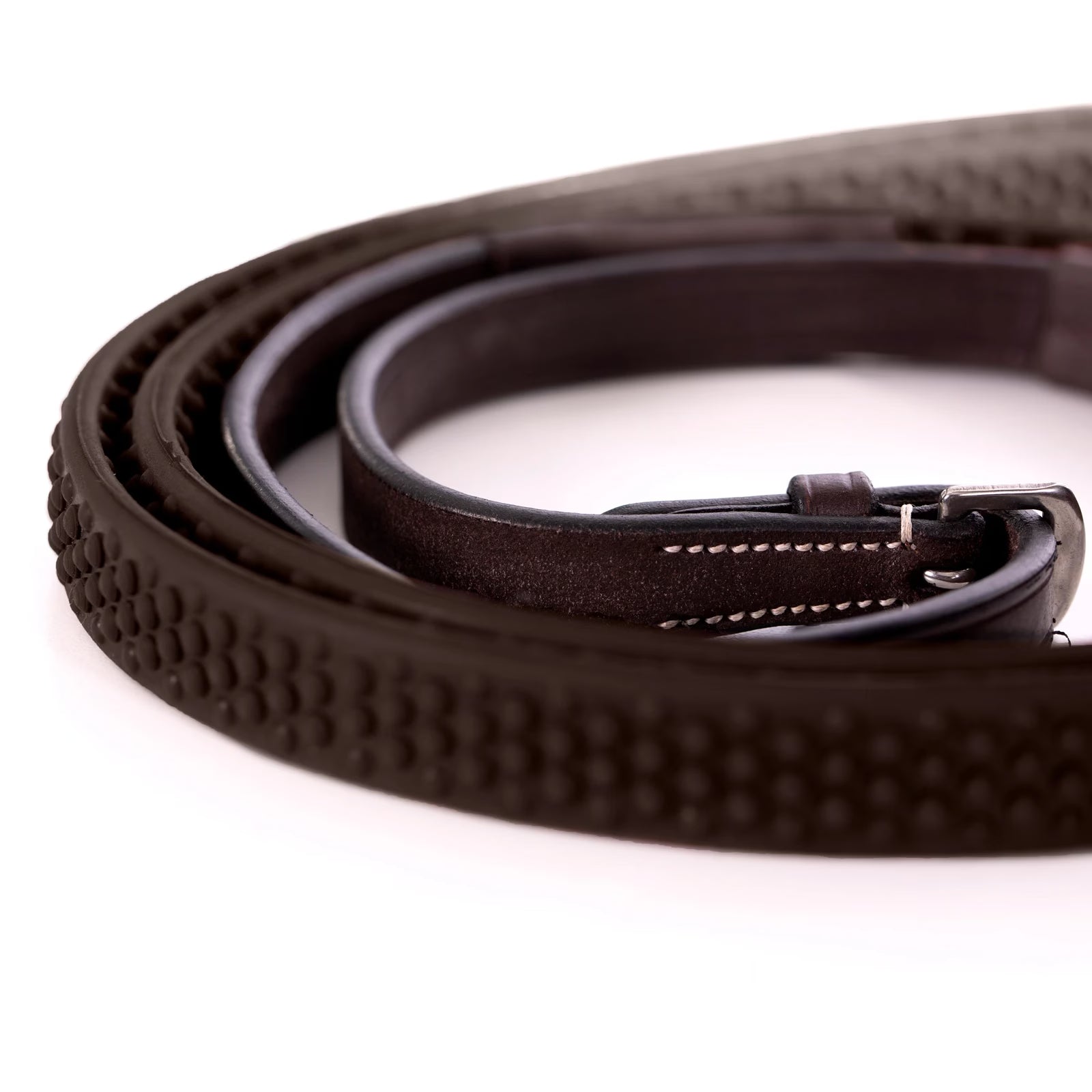 Close-up view of the rubber pebble grip reins on the Equinavia Valkyrie Fancy Stitched Figure 8 Bridle & Reins on a plain background
