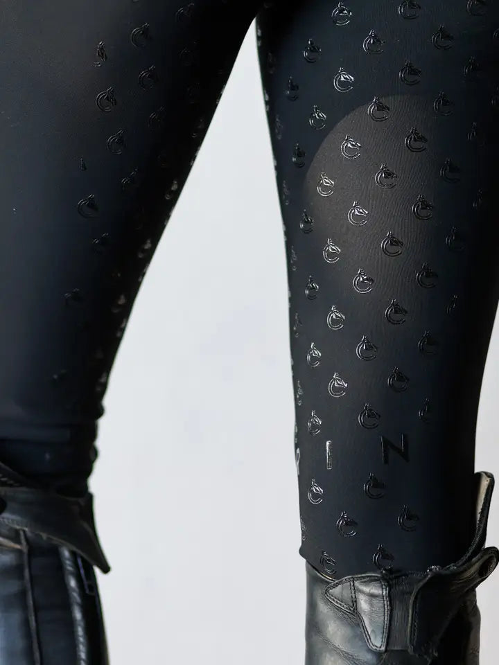 Close-up view of the silicone grip on the black Criniere Alice Full Seat Lightweight Full Seat Breeches