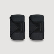 View of a pair of black Incrediwear Circulation Exercise Bandages on a plain background