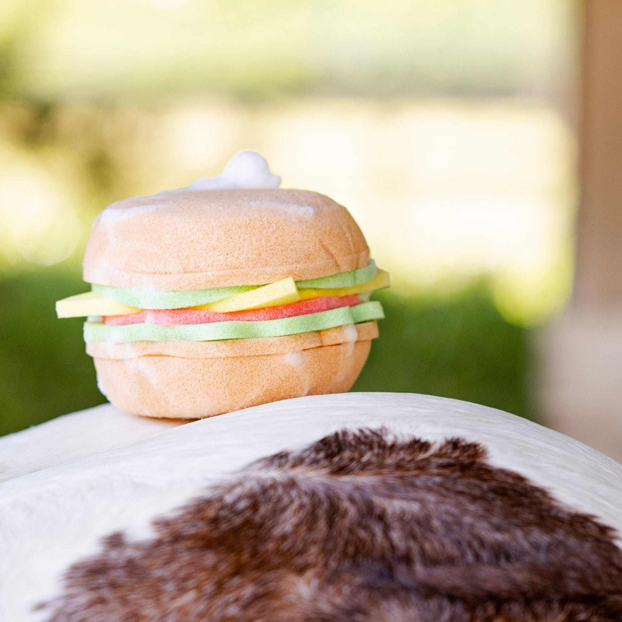 View of the Blue Ribbon Burger Bath Sponge sitting on top of a horse's bottom