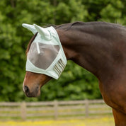 Side view of horse outdoors wearing the Equinavia Algard Soft Mesh Fly Mask in Misty Jade